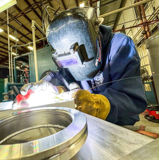 Stephan Dupnak, a second-year welding apprentice, welding