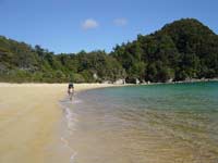 Rich hiking along the beach