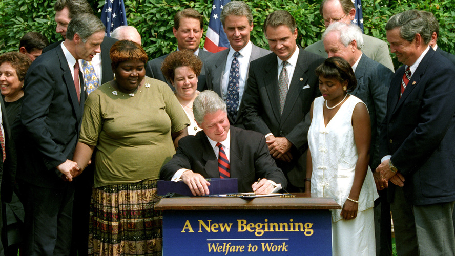 President Clinton signs the welfare reform law on Aug. 22, 1996.