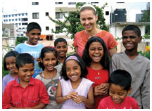 Julia Neubauer ’07 with children