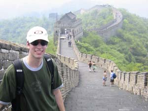 A PiA intern poses at the Great Wall of China