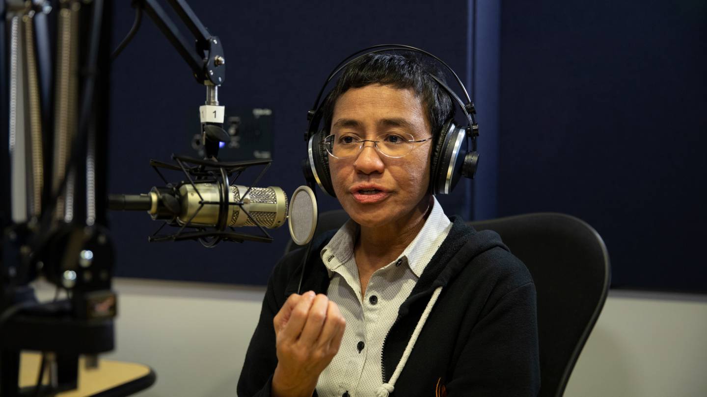 Maria Ressa is interviewed in a sound booth