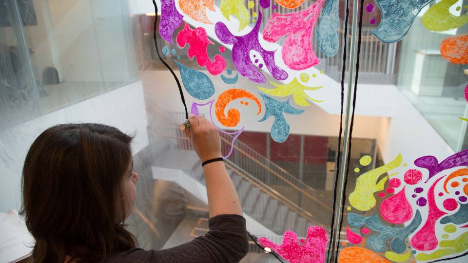 Student window painting in the neuroscience building