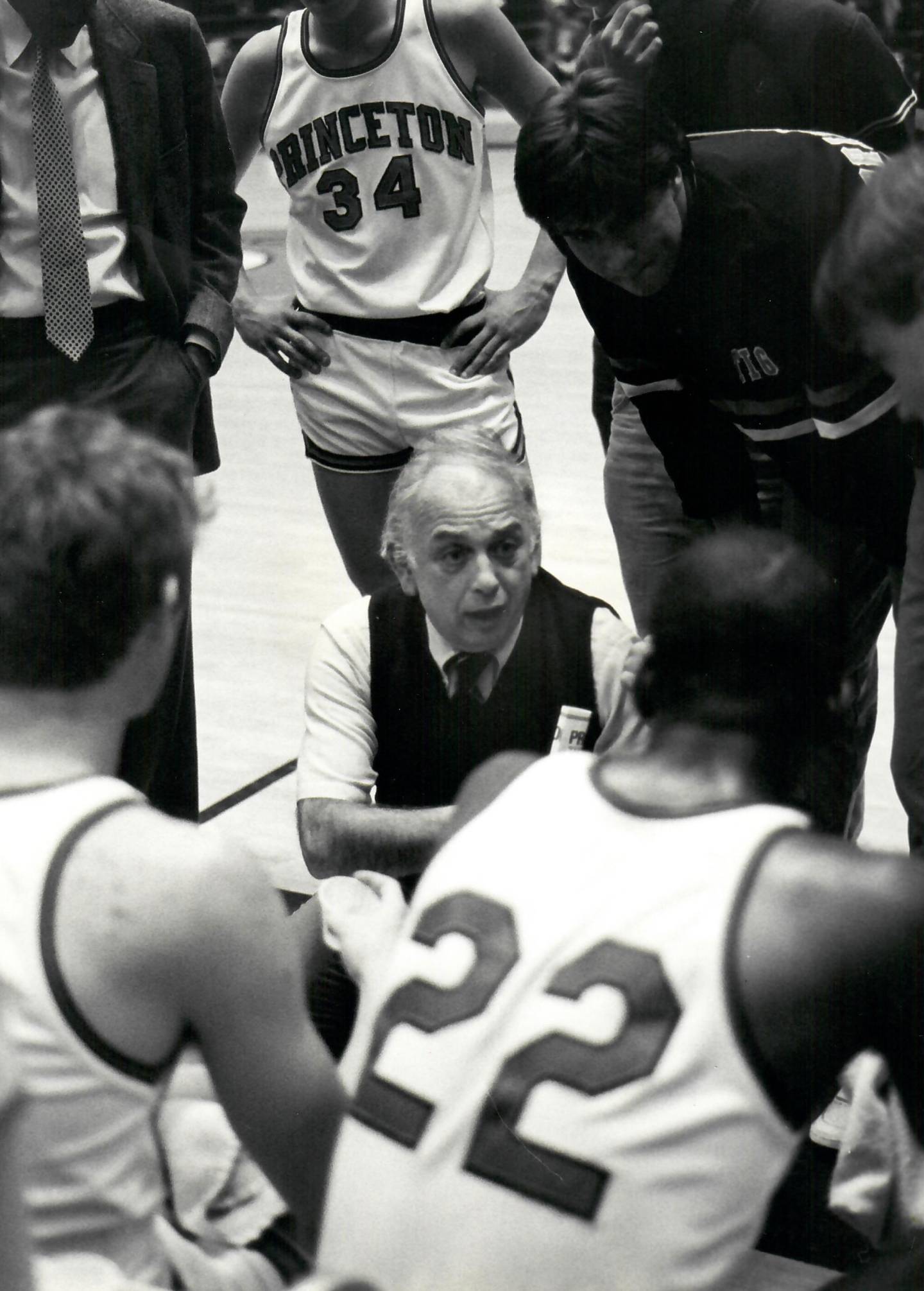 Coach Carril huddling with his team