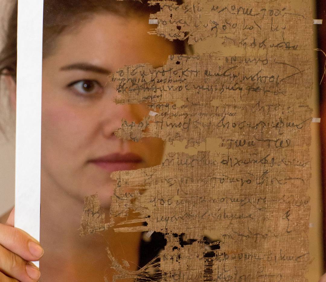 Graduate Student Katherine PD Huemoeller studying papyrus