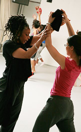 Harvey works with senior Rebecca Lee, who said the most important lesson she has taken from the course "is to dance my heart out."