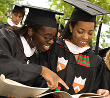 Students looking at program