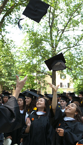 Commencement caps in air