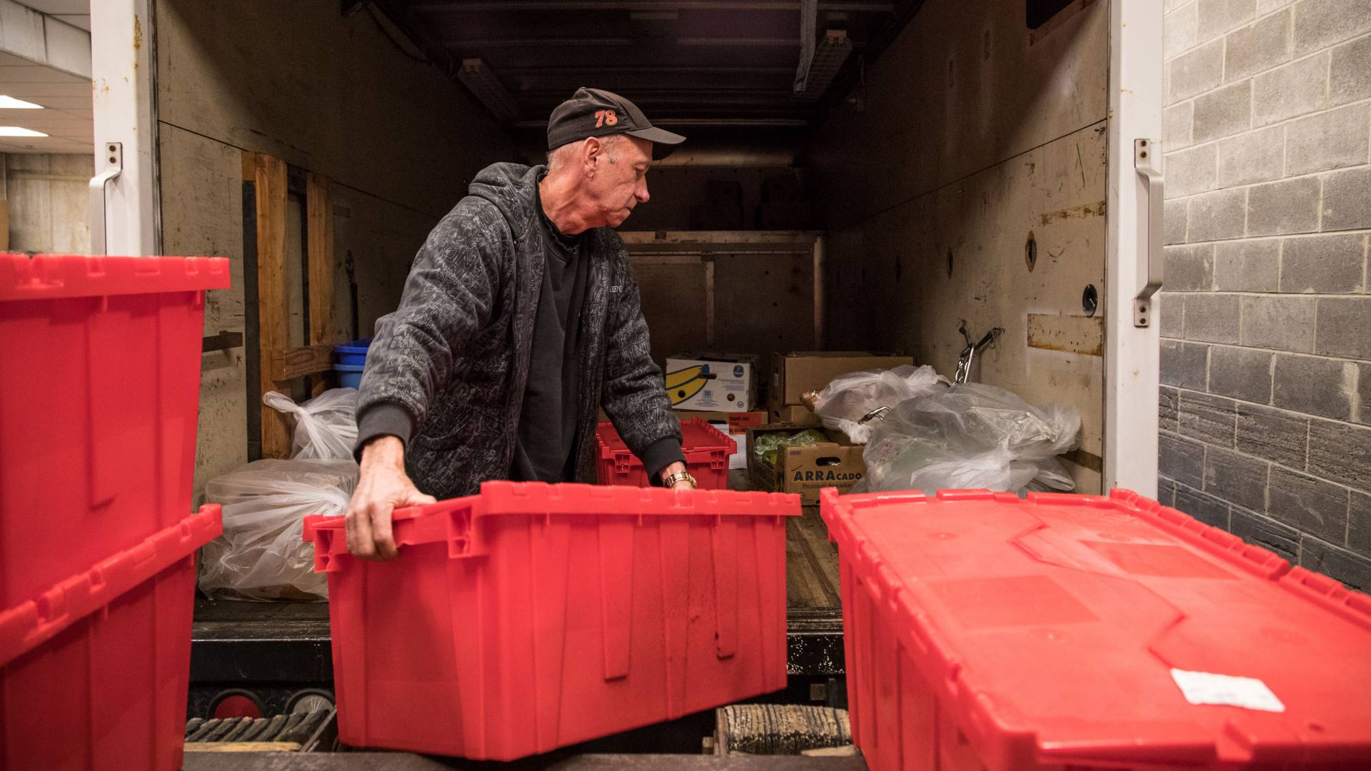 Loading cartons of food onto truck