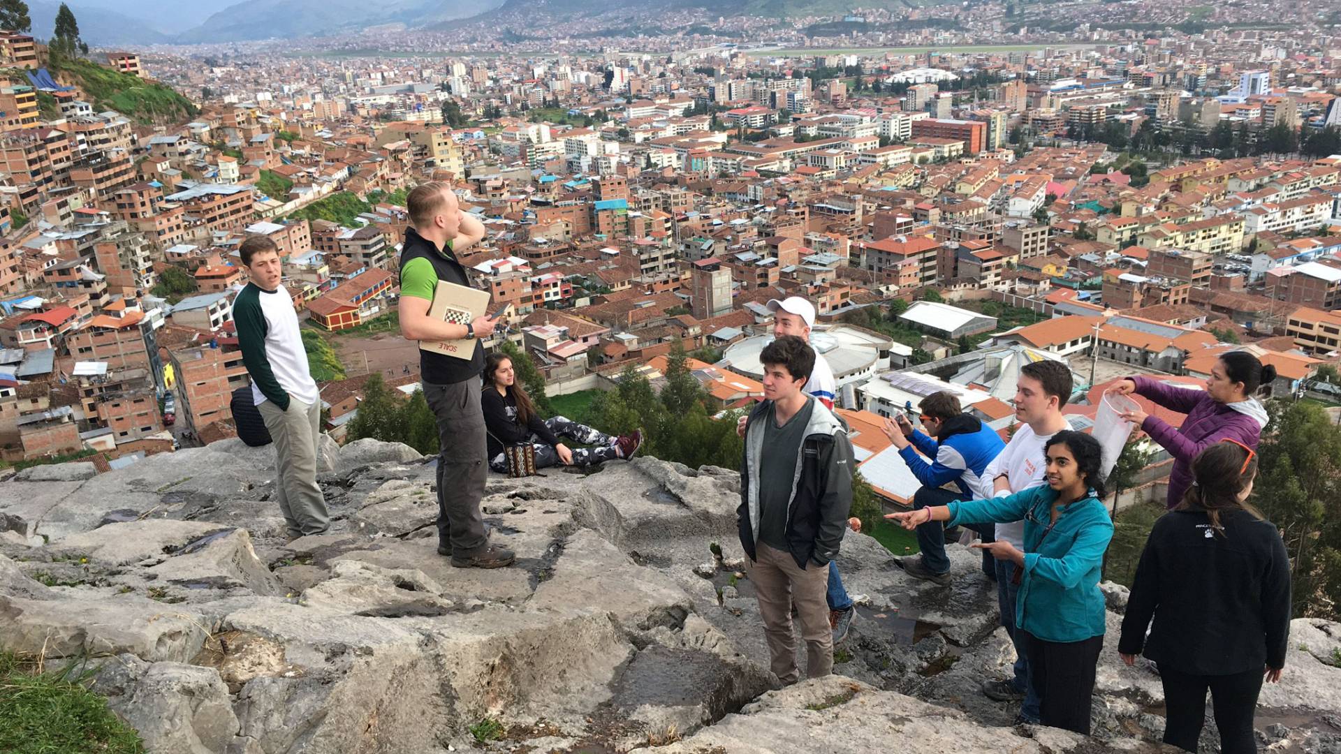Students standing on lookout point above Cusco