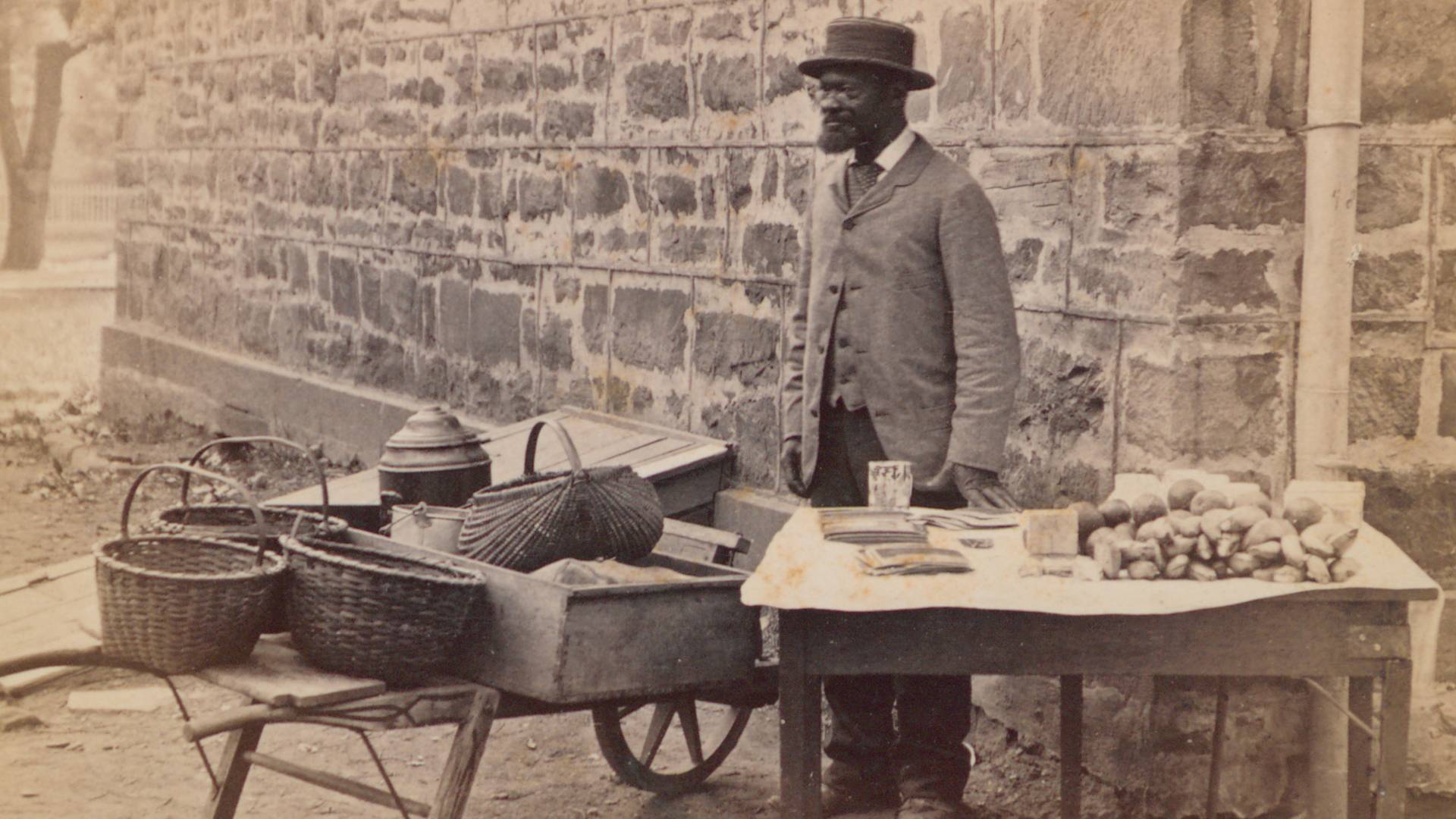 James Johnson standing by table outside Nassau Hall circa 1881