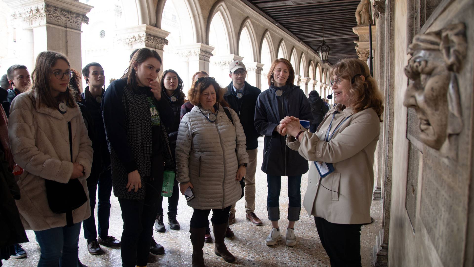 Tour guide with students outside the Doge's Palace in Venice