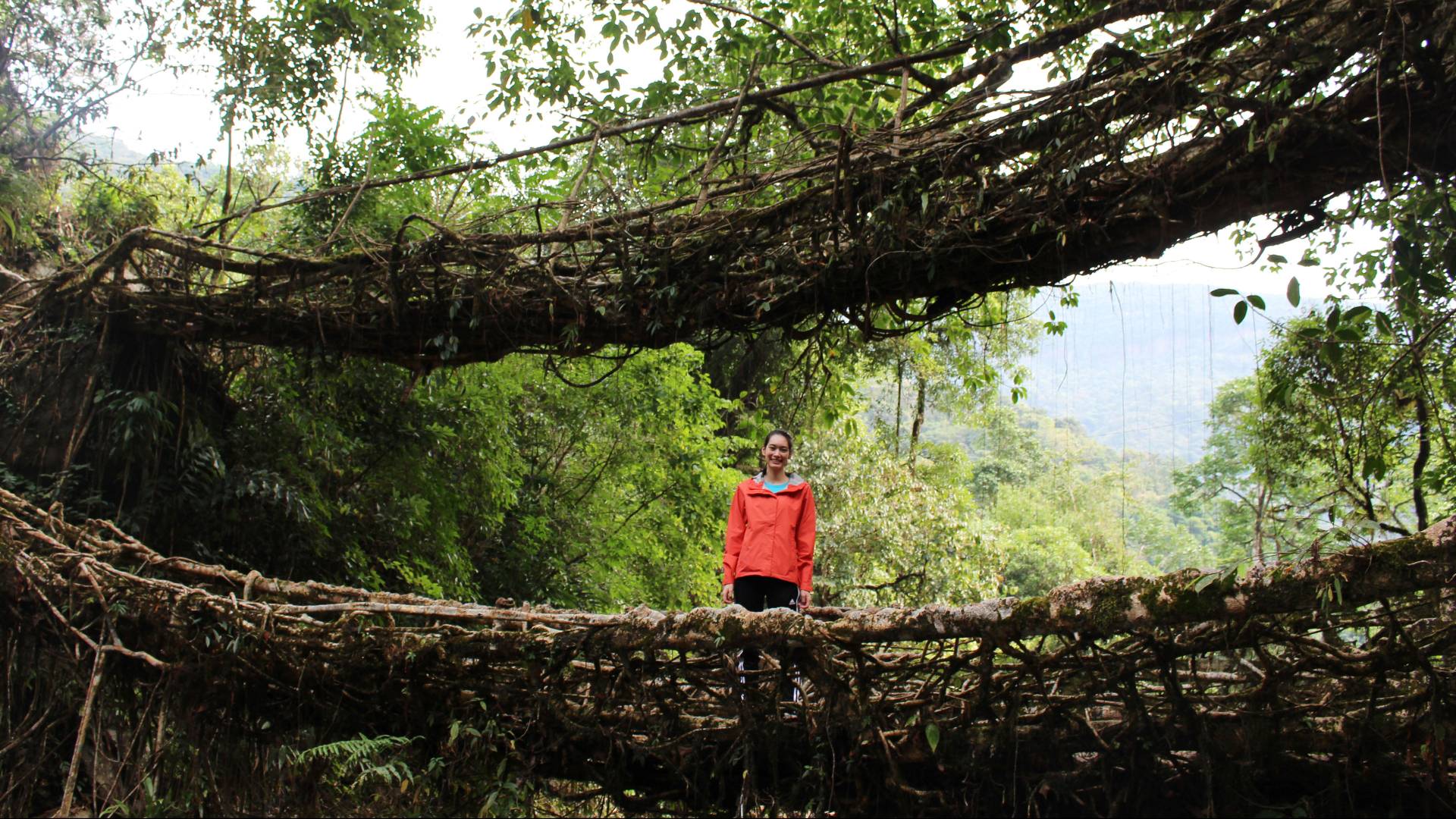 Katie Kennedy standing by bridge in India