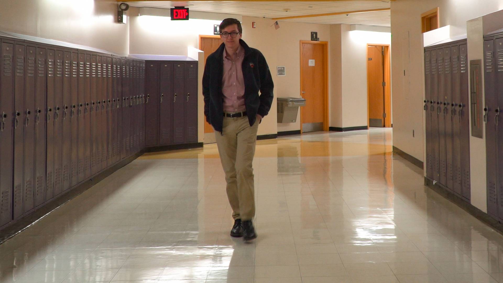 Tyler Simko walking down high school hallway