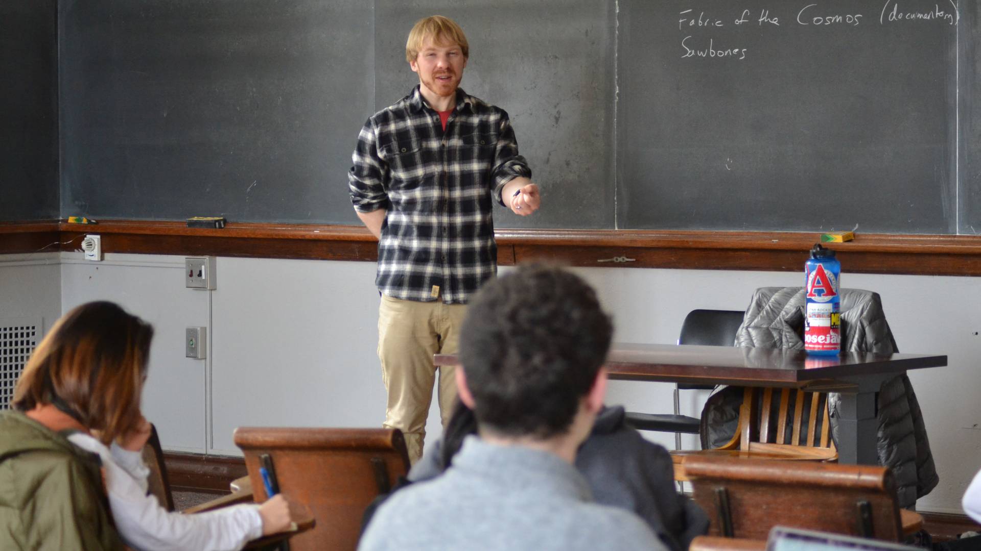 Brian Kraus at chalkboard teaching wintersession class