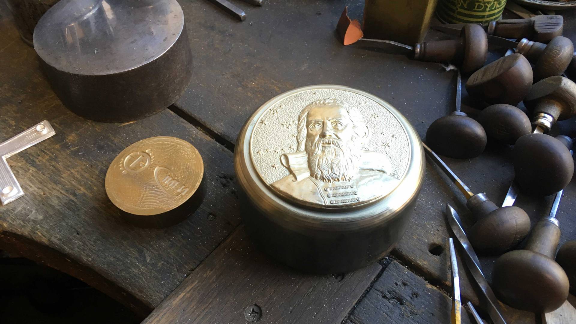 Galileo Medal surrounded by artisan tools
