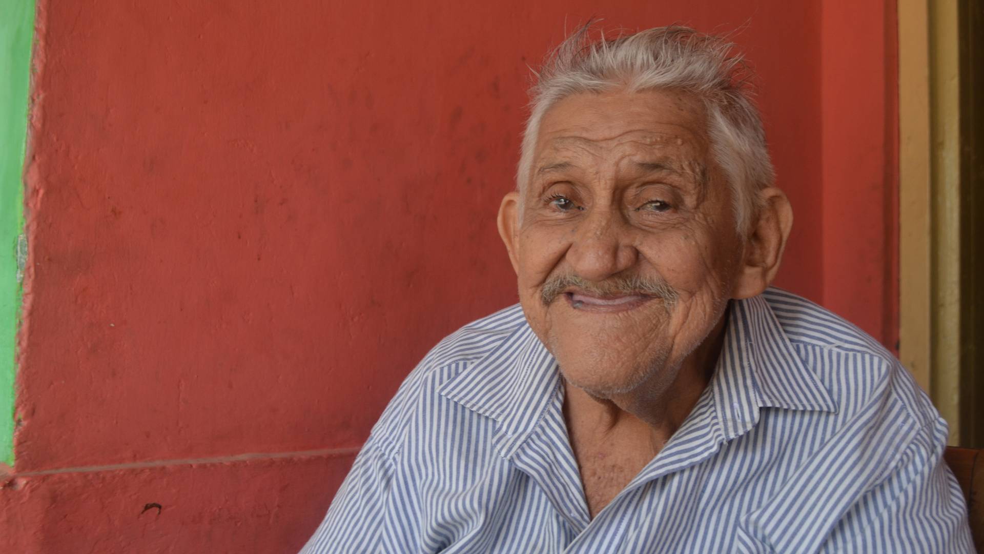 Elderly man smiling at camera