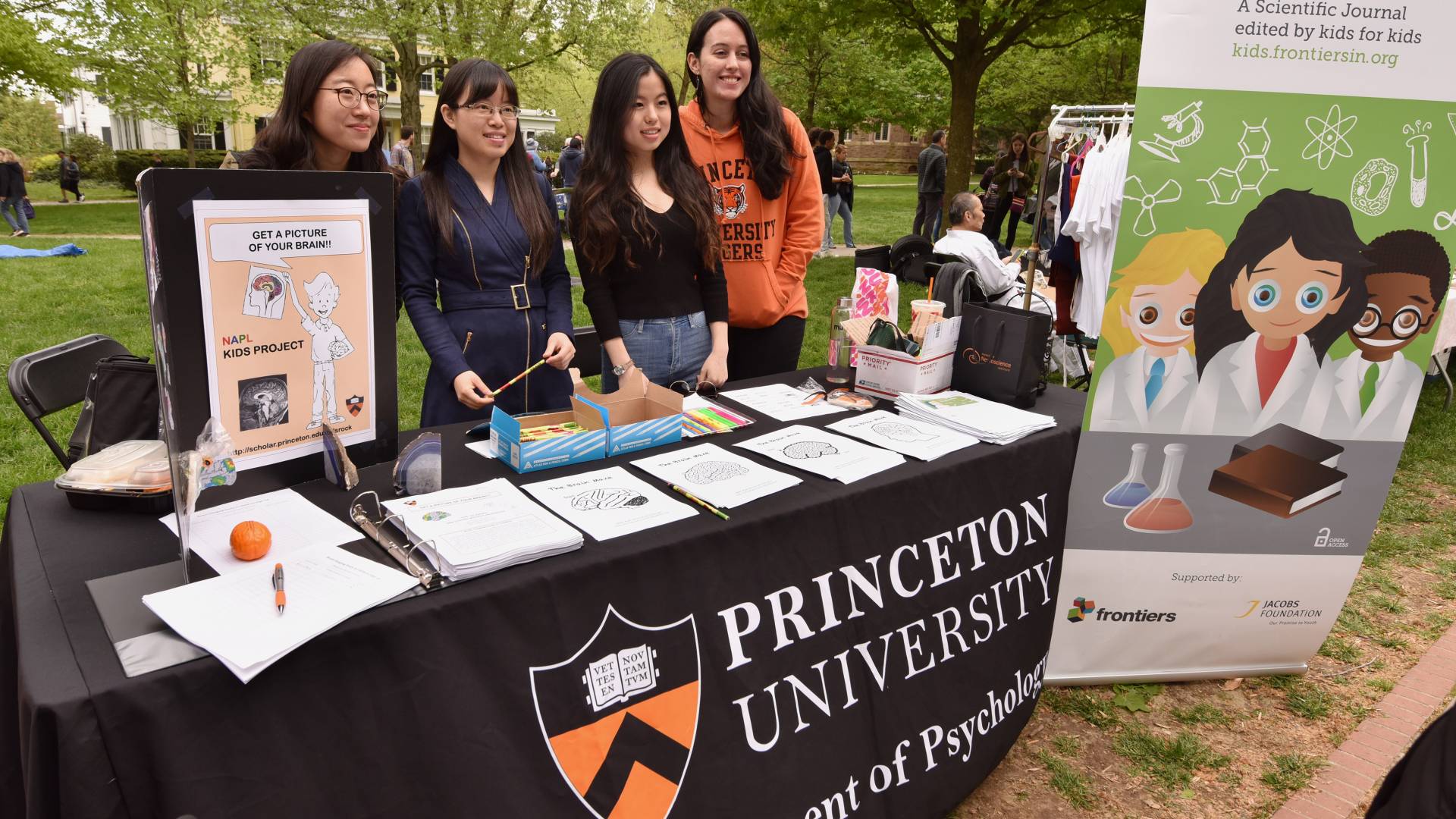 4 women behind a table promoting the activities of the department of psychology