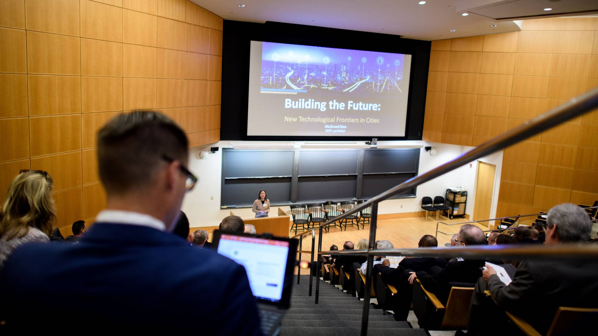 Emily Carter speaks to an audience in an auditorium