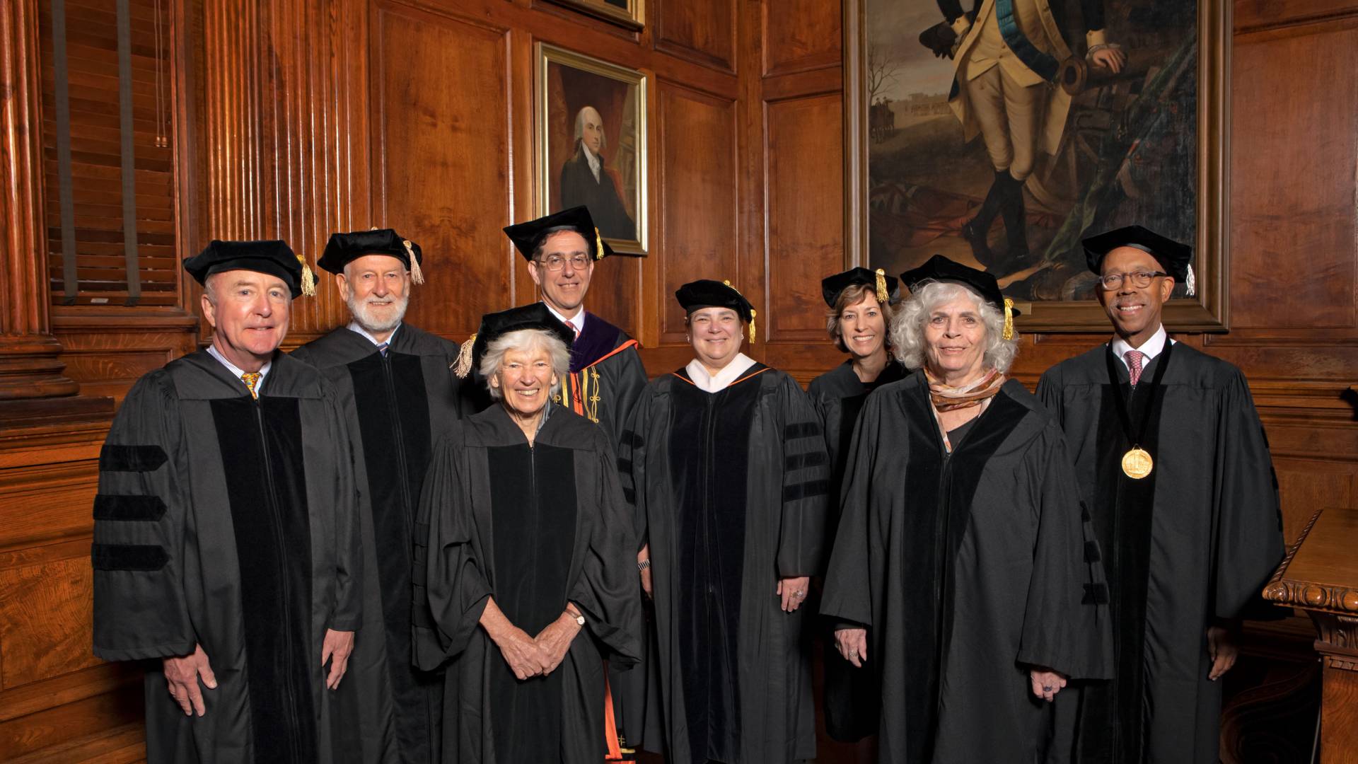 Recipients of honorary degrees pose in their ceremonial robes and mortarboards