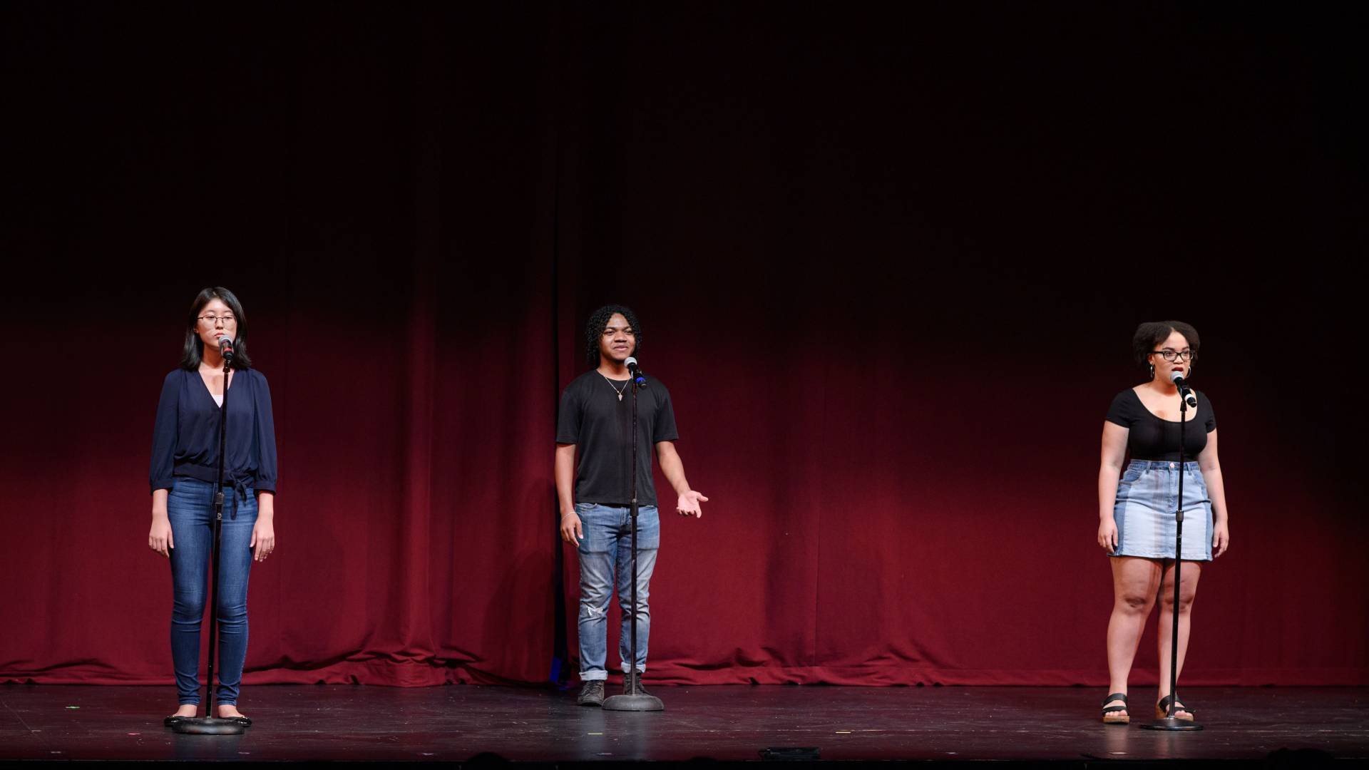 3 students perform in the student story slam ensemble