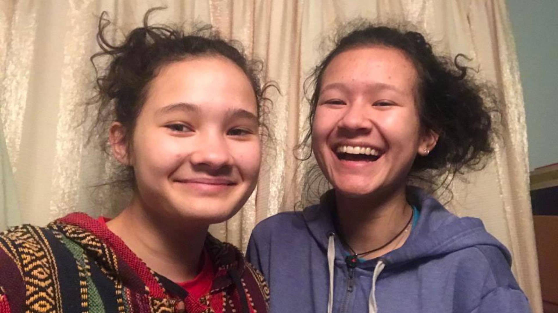 A student poses with her sister