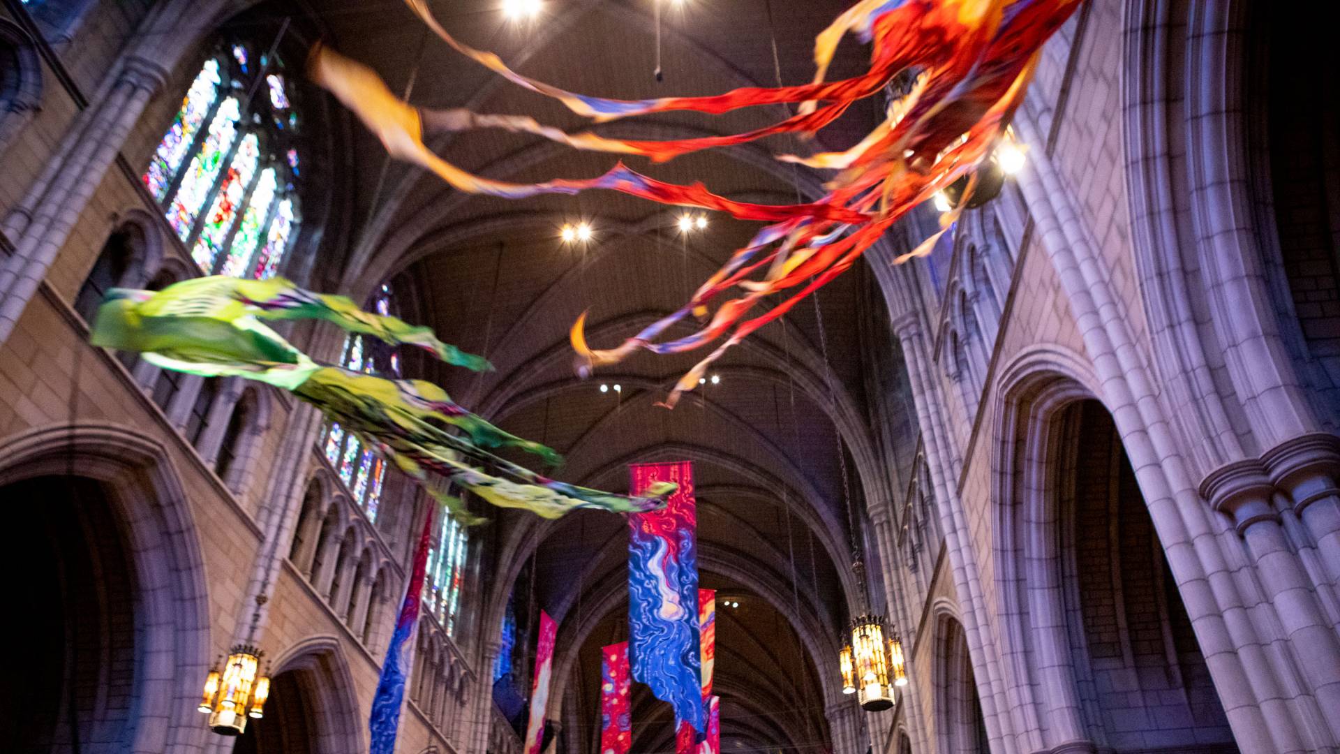 Kites fly in the University Chapel as a traditional part of Opening Exercises