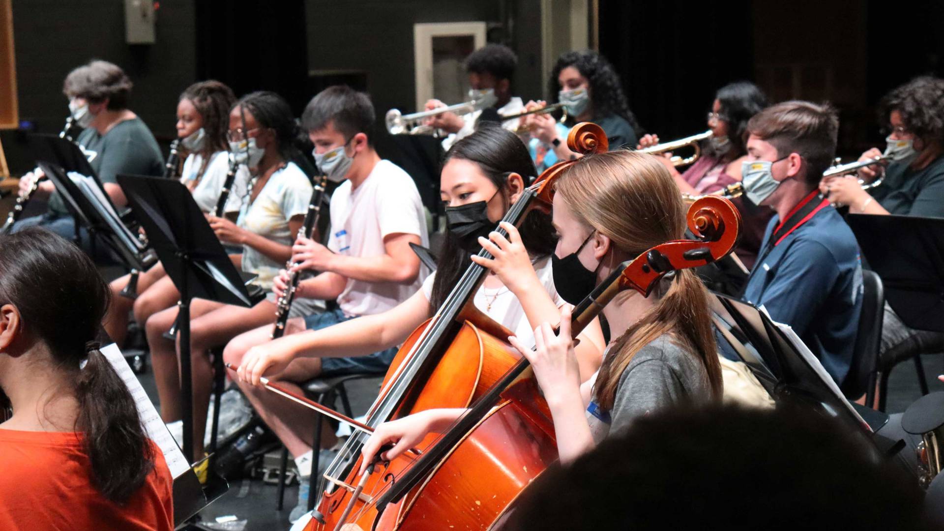 Students playing instruments in an orchestra