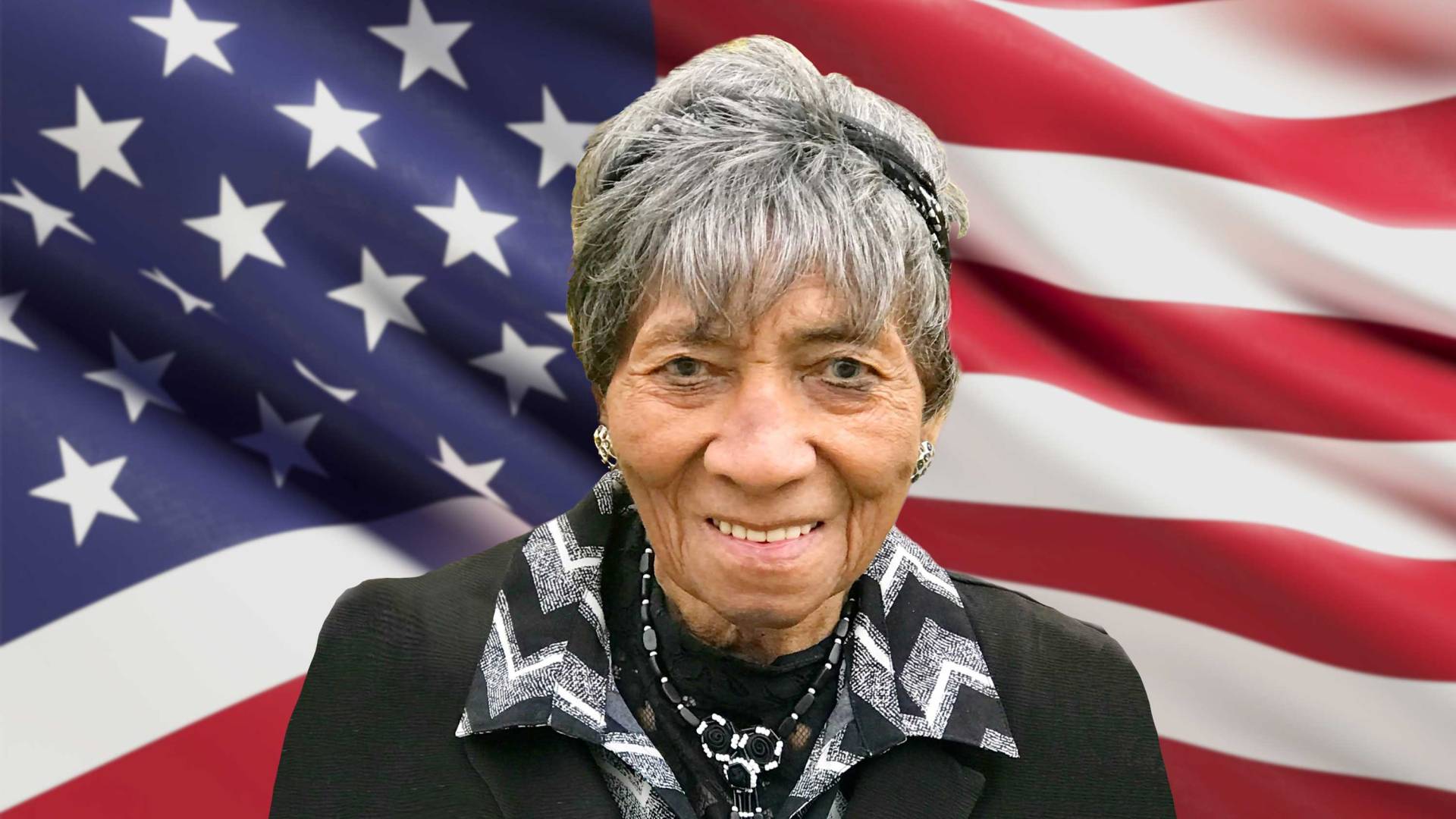 Laura Wooten in front of an American flag