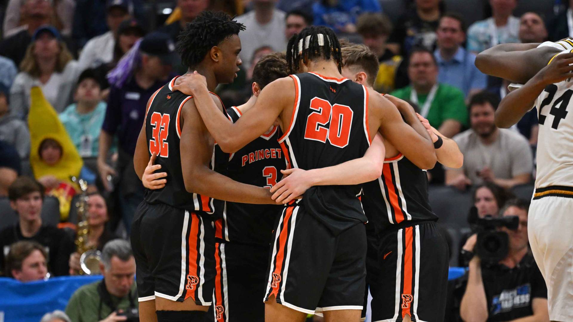 Princeton basketball team in a huddle