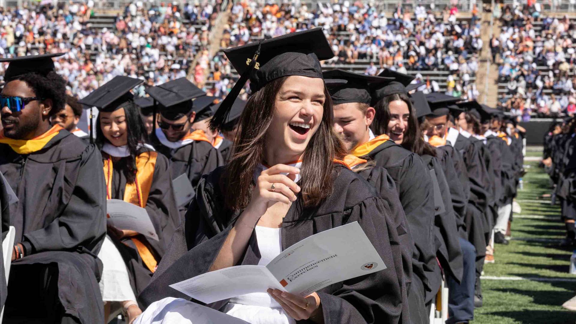 Graduating student laughing