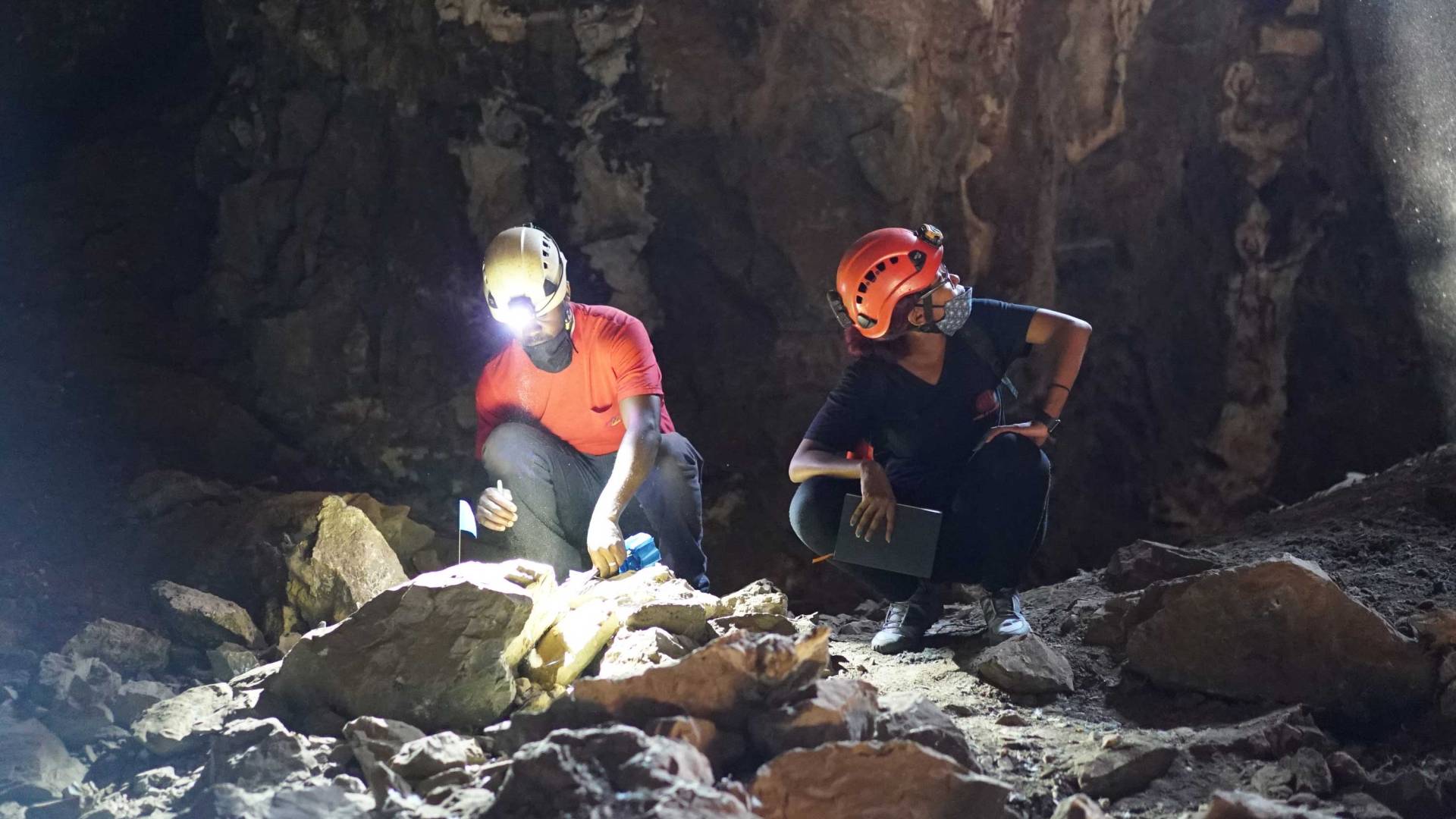 two researchers in a cave
