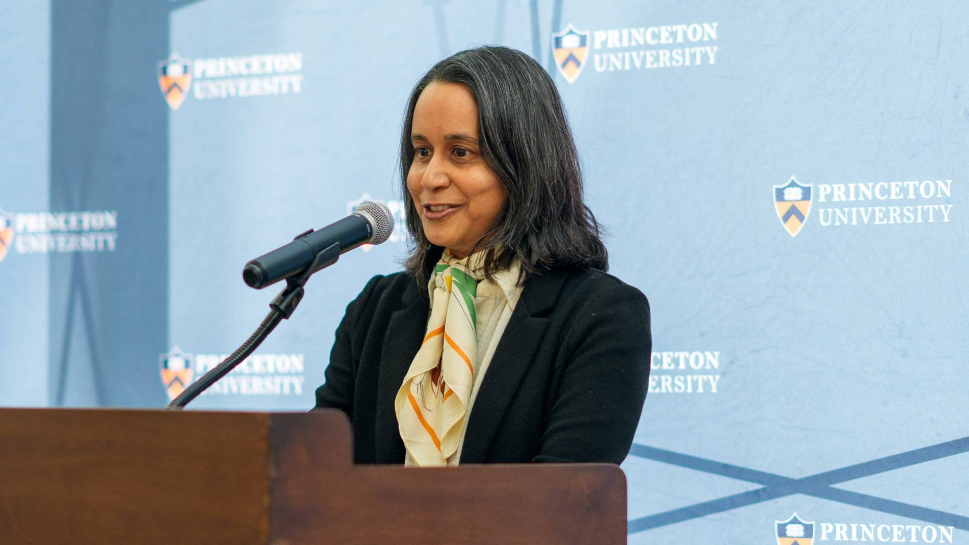 Mala Murthy at the podium