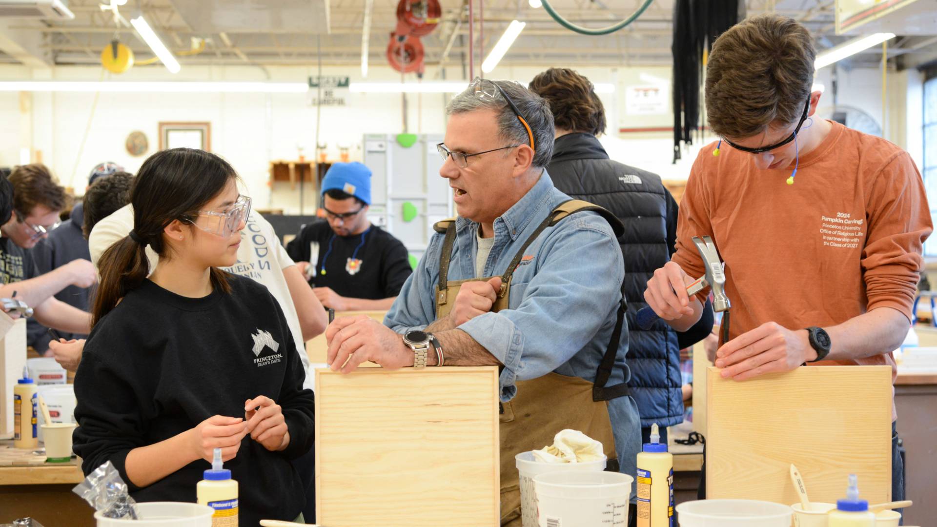 A group of people building checker boards