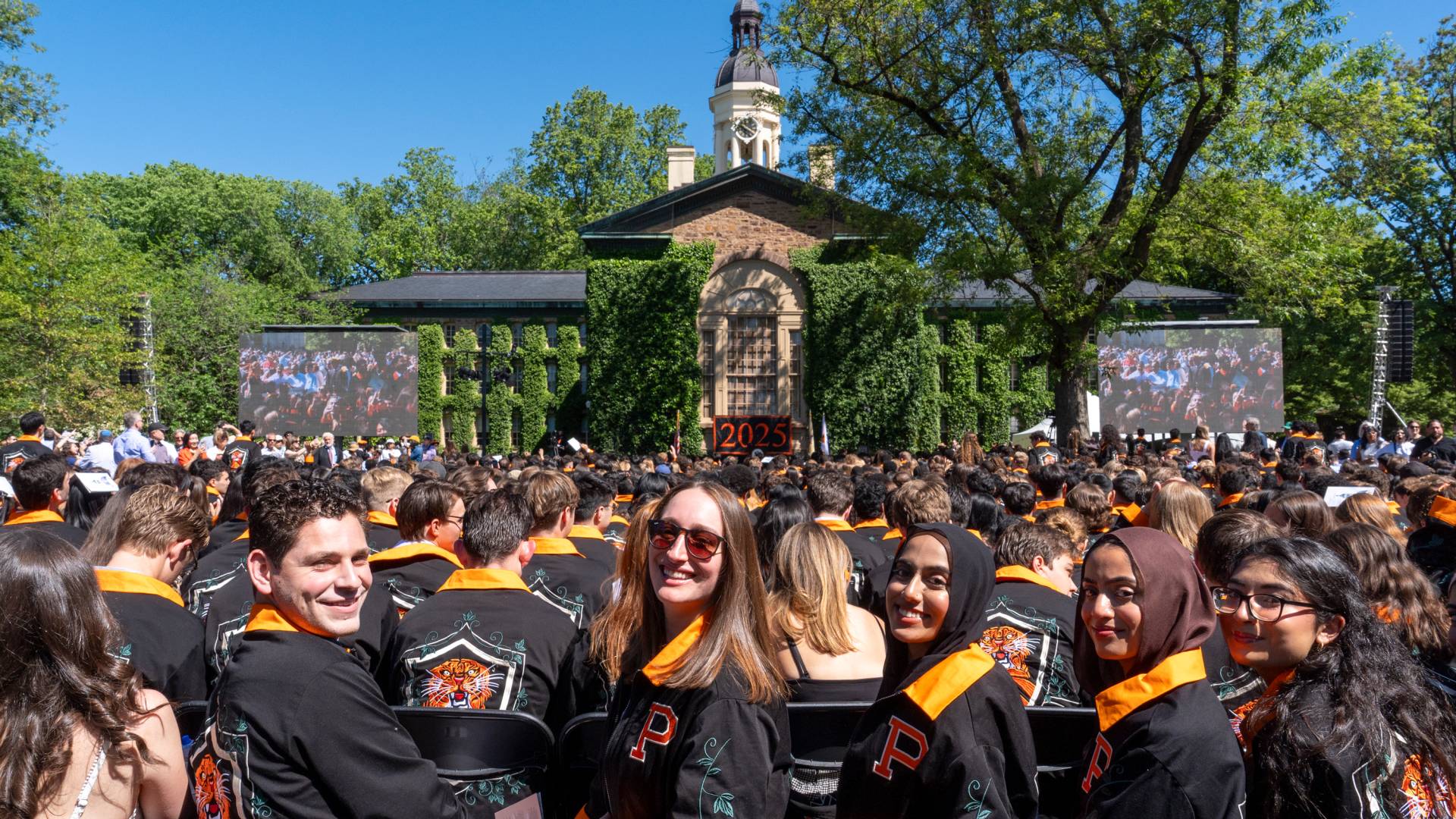 Seniors at Class Day with Nassau Hall in the background.