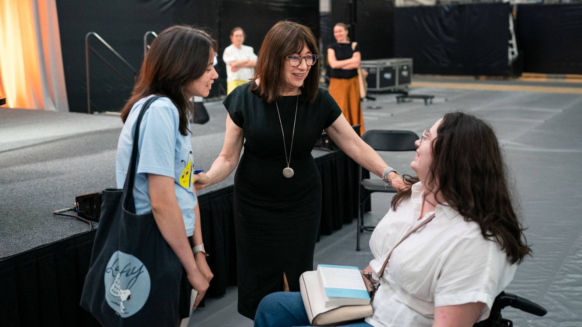 Author Maryanne Wolf speaks with students after the event.