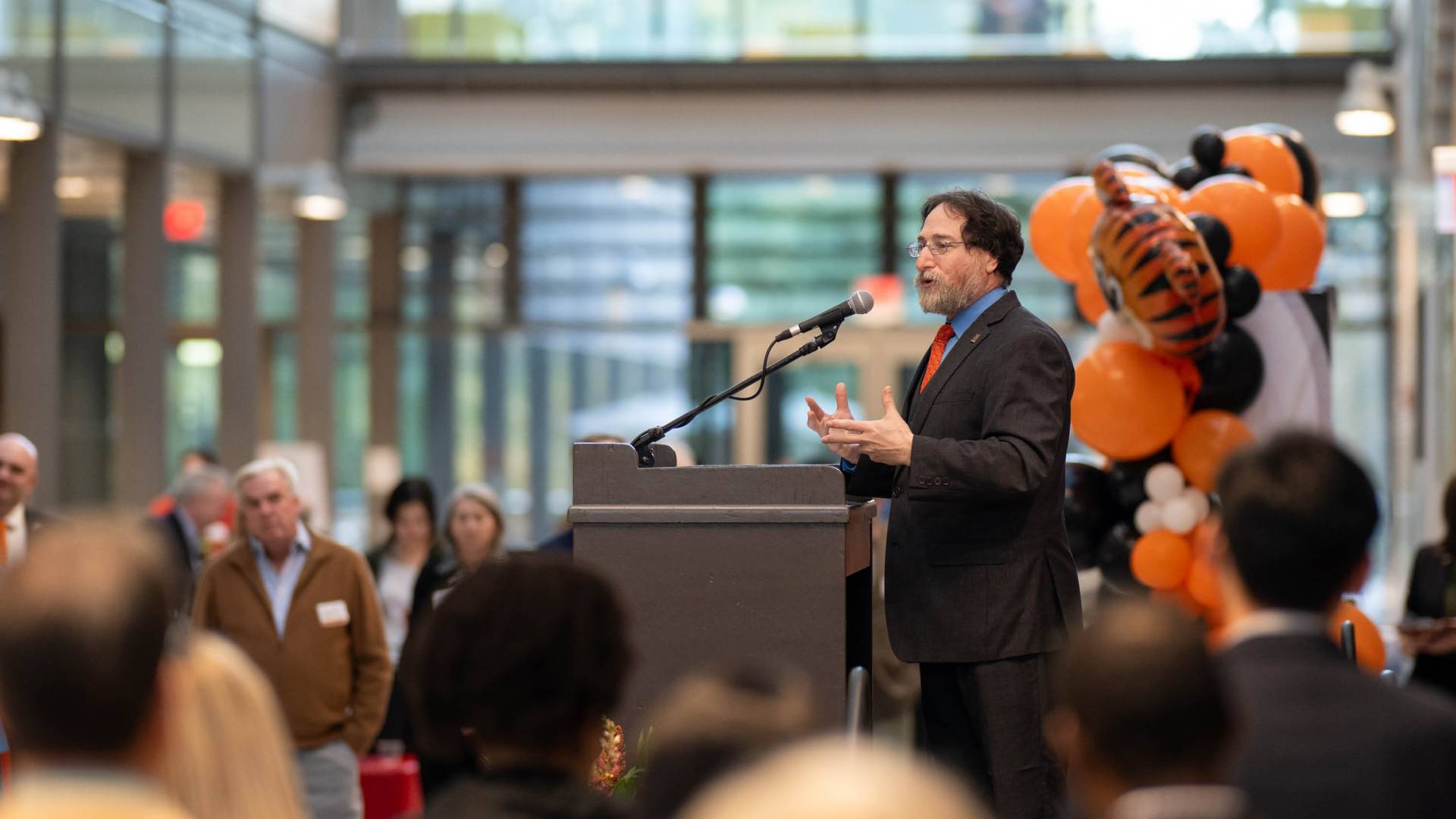 Vice dean for Innovation Craig Arnold speaks at a podium to attendees