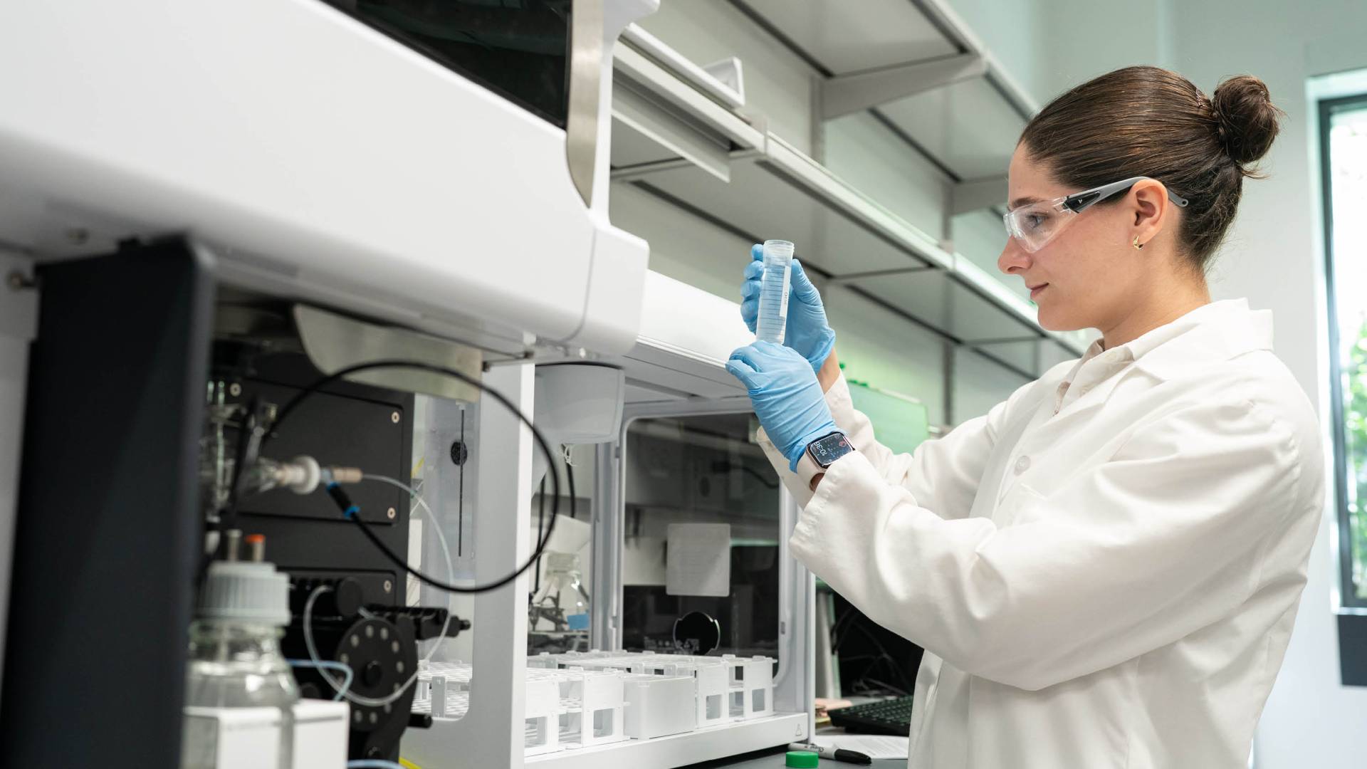 A Ph.D. student researces lunar cement in a lab