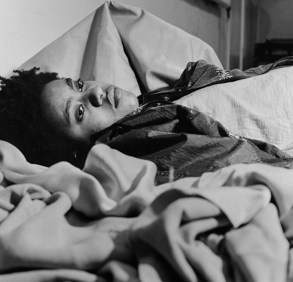 Black and white portrait of student lying down