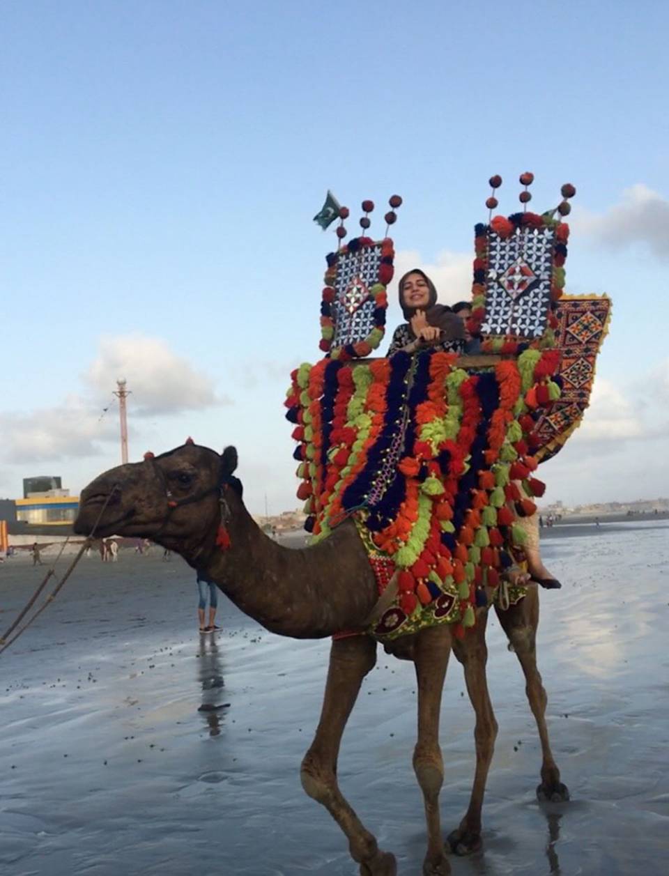 Rabia Khan riding camel in Pakistan