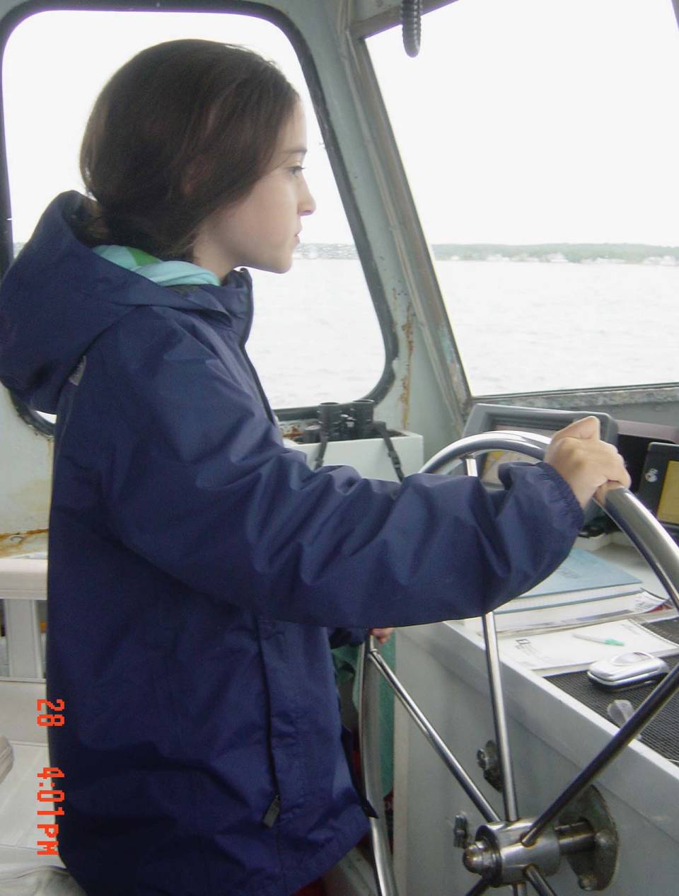 Rachel Sturley as a child steering a boat