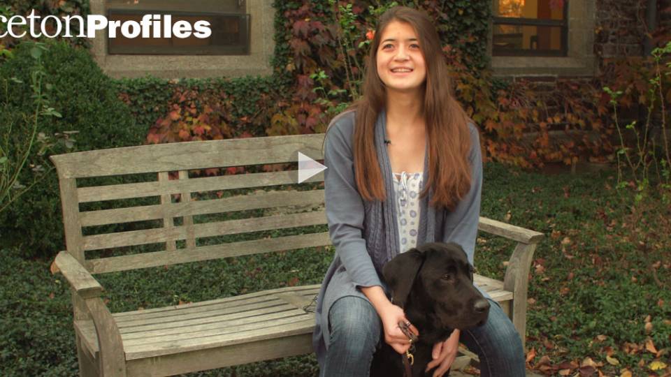 "Princeton Profiles" Camden Olson sitting on bench with dog
