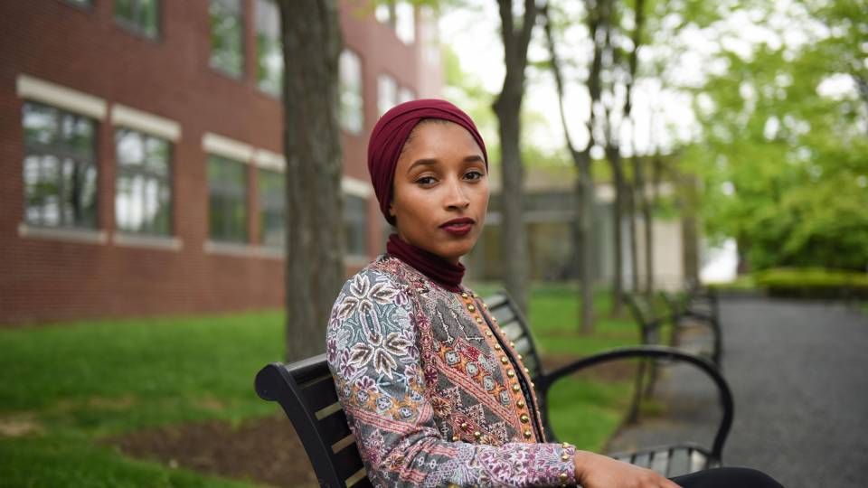 Sajda Ouchtouki sitting on bench outside