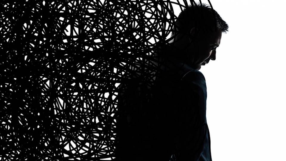 Silhouetted man with swirling lines behind him
