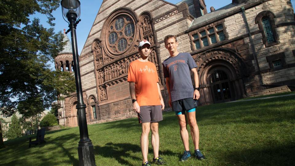Nick Feamster stands to the left of Nolan McCarty outside