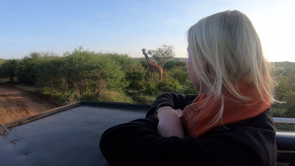 Zoe Sims watching giraffe at Mpala in Kenya
