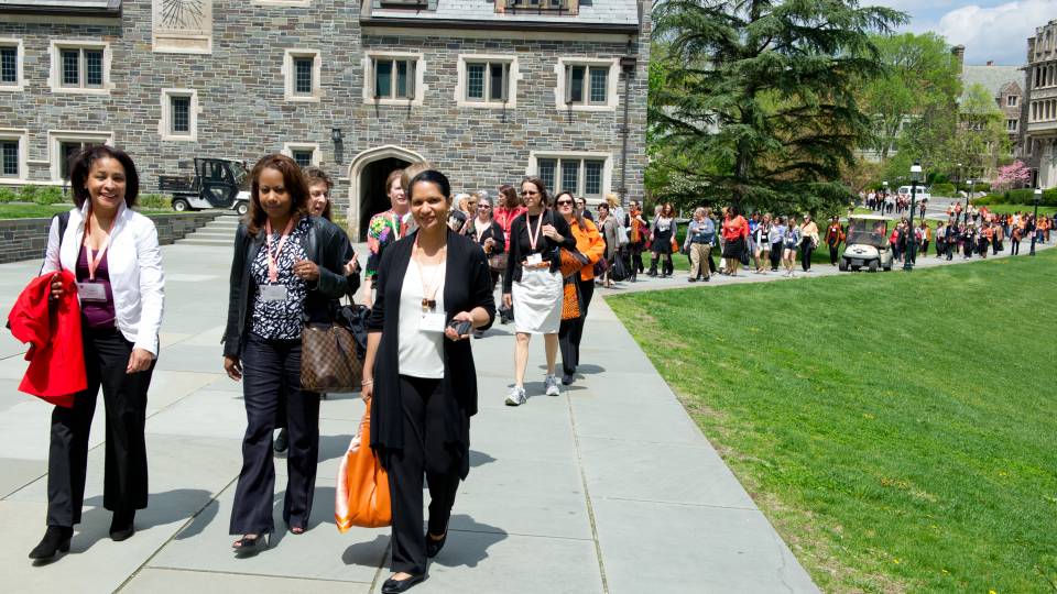 Alumnae walking down the hill from Whitman College