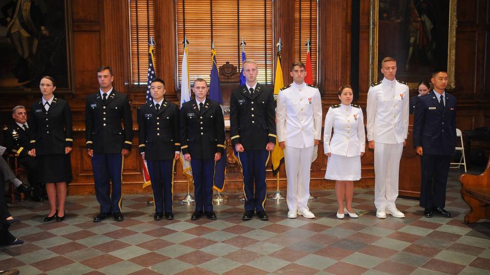 Graduates from Princeton's ROTC program stand together
