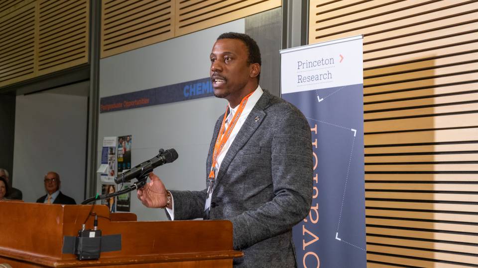 Rodney Priestley speaks at a podium during an event