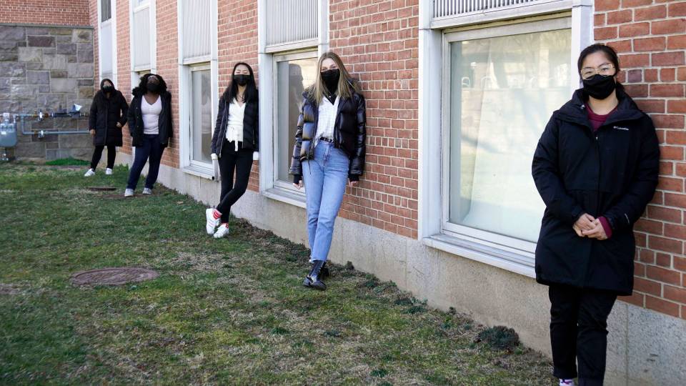 masked students in a group
